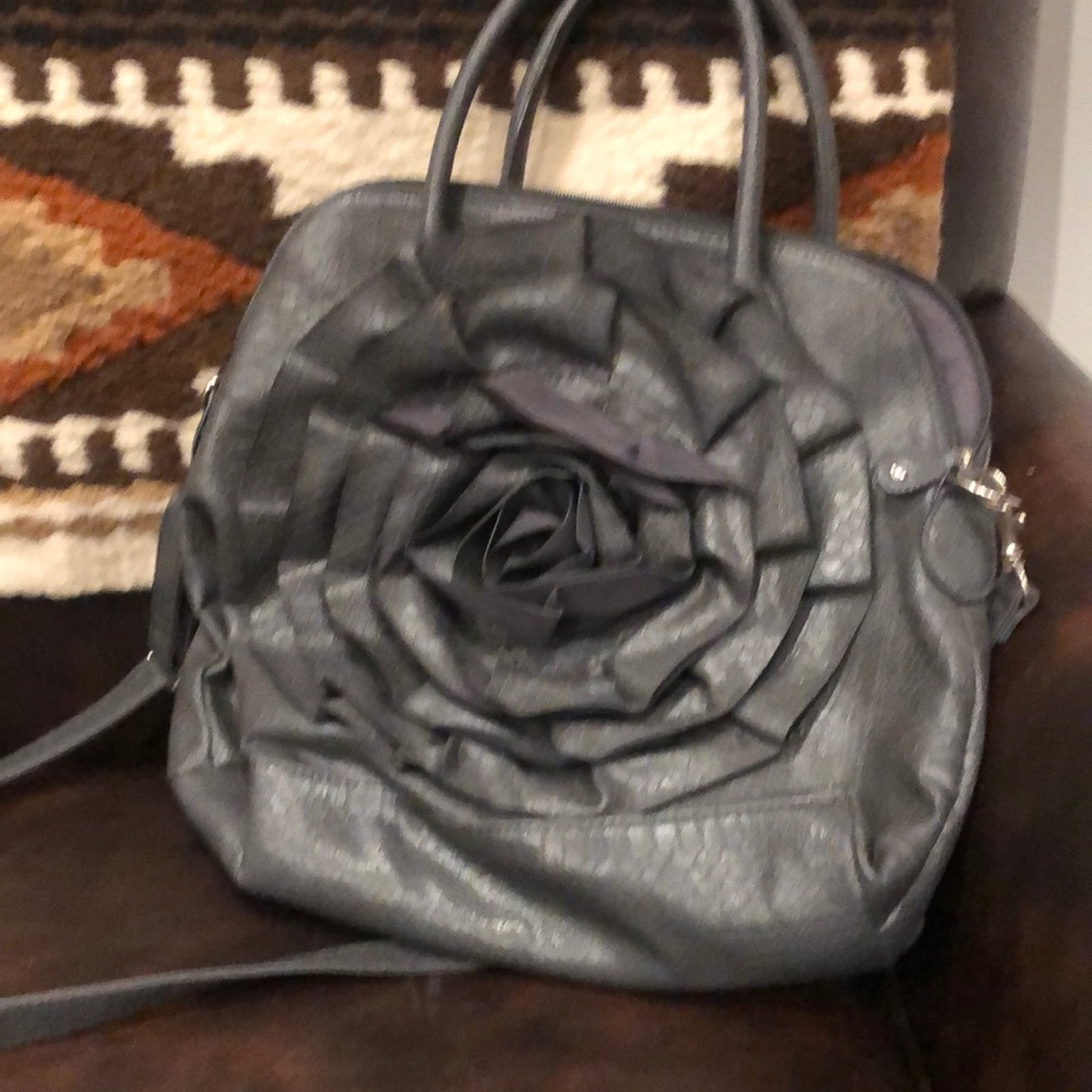 Nice tote purse by big Buddha with flower on front